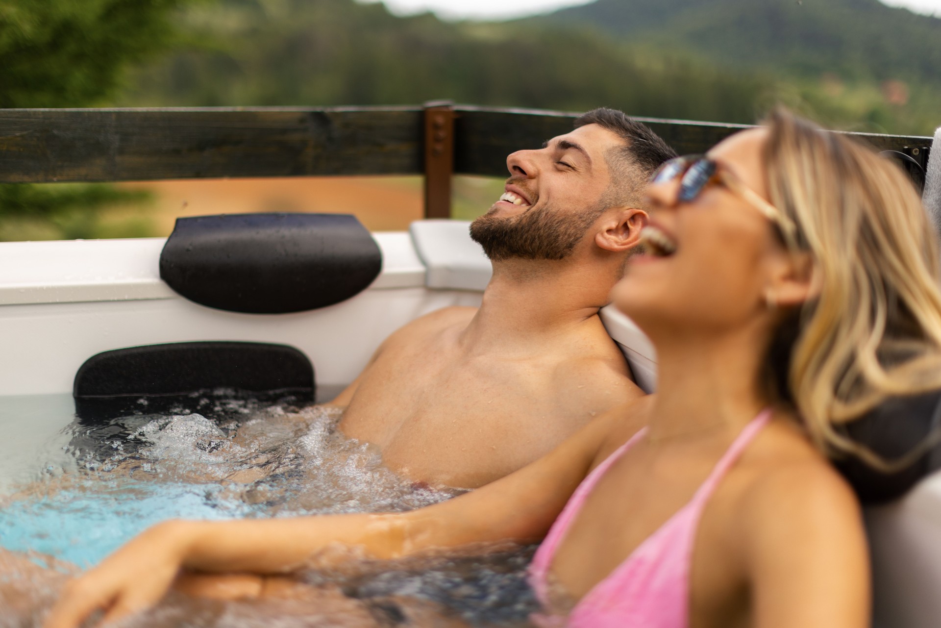 Couple enjoying outdoor hot tub